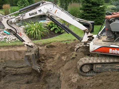 digging a pond with mini digger|digging a backyard pond.